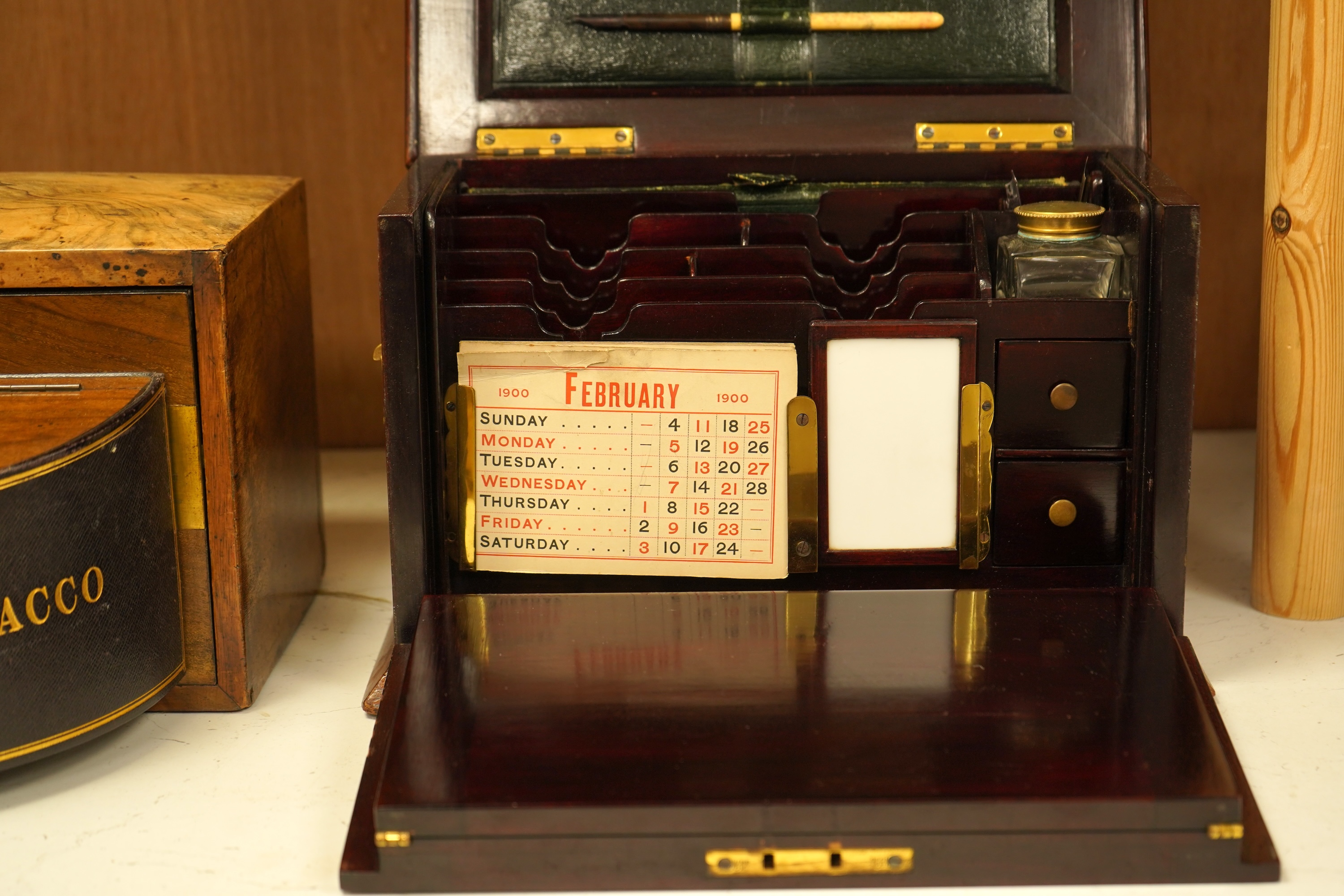 An Edwardian inlaid mahogany writing casket with fitted interior and a late Victorian faded walnut cigar box, largest 32cm wide